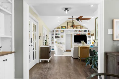 a view of a livingroom with kitchen and furniture