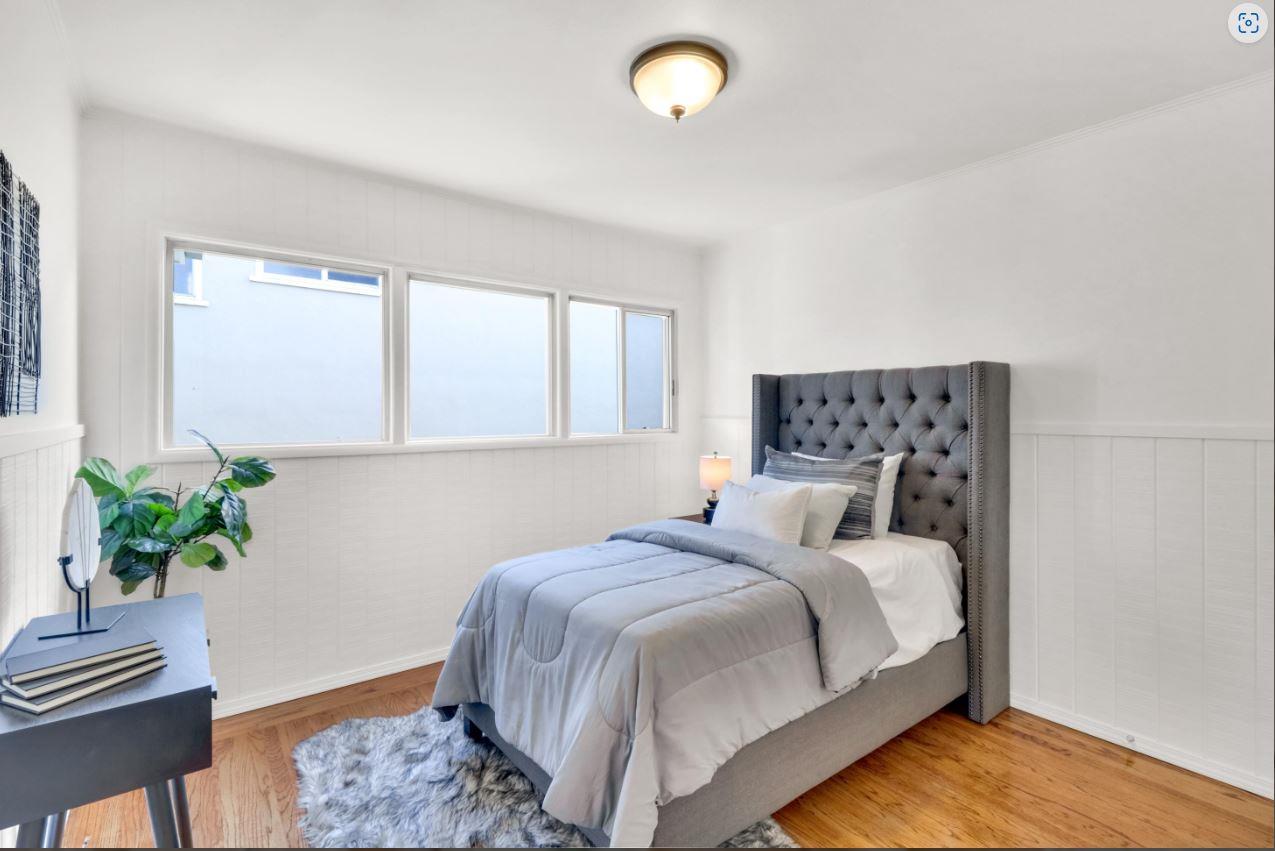 58 Pinehaven Drive Daly City, CA 94015 - Photo 18 of 38 a bedroom with a bed and a potted plant