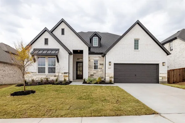 a front view of a house with yard