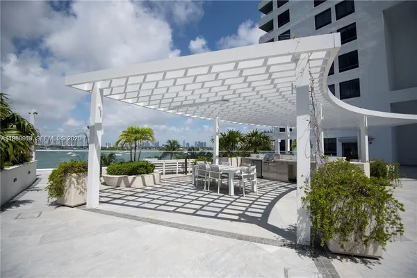 a view of a building with sitting area