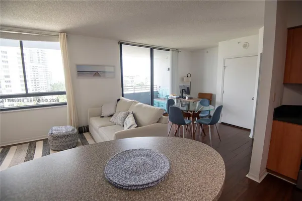a living room with furniture and a large window