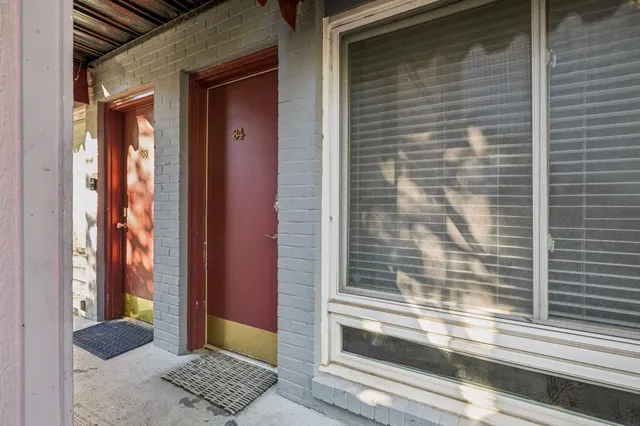 a view of a door and a window