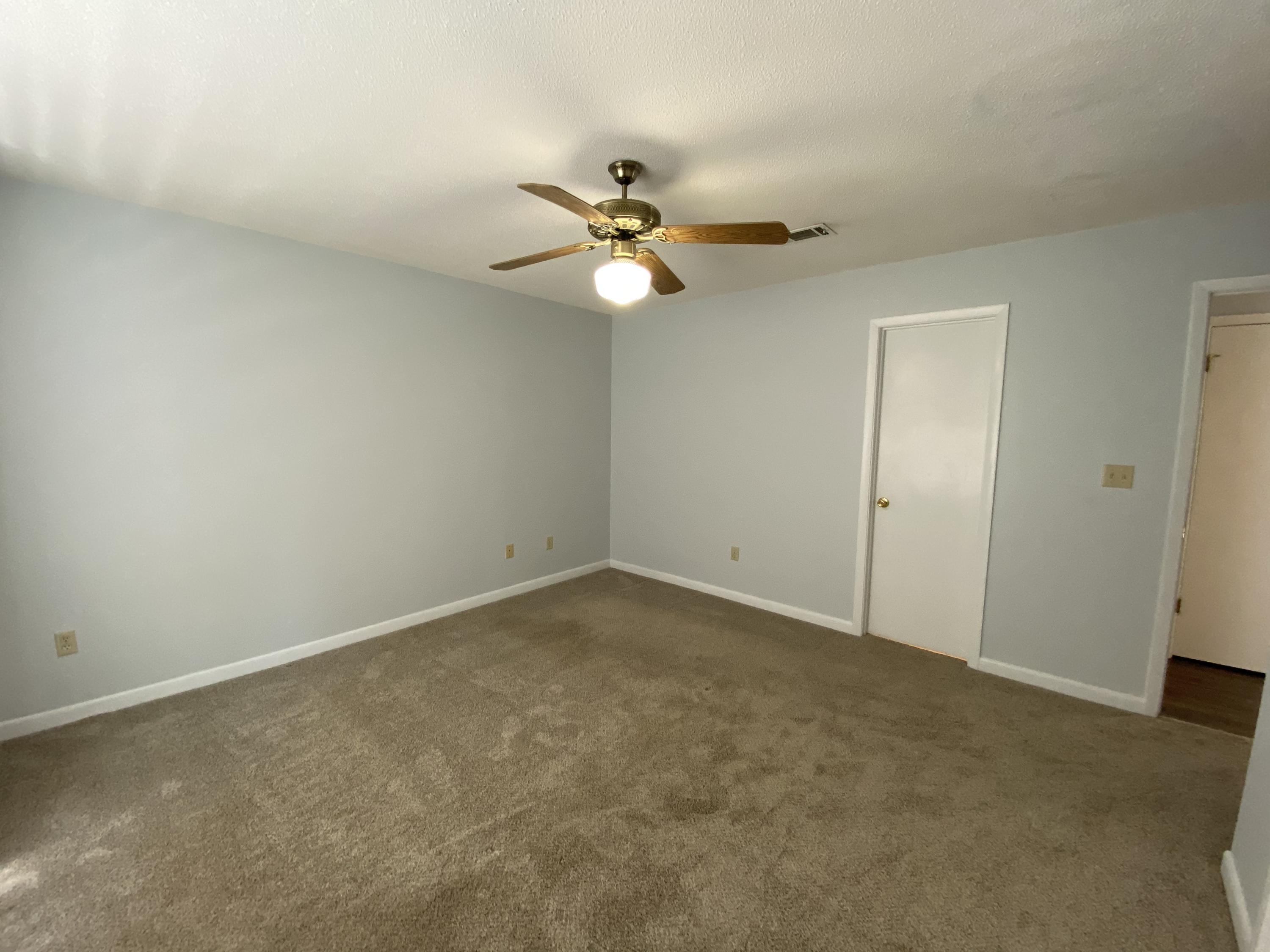 169 Wright Circle Niceville, FL 32578 - Photo 14 of 27 an empty room with a fan and a fan