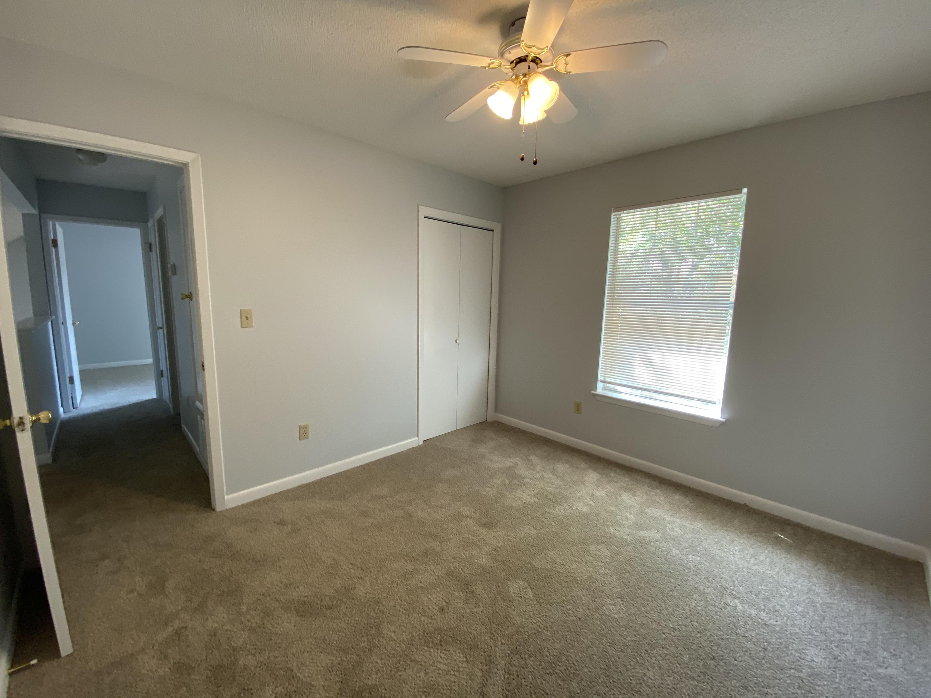 169 Wright Circle Niceville, FL 32578 - Photo 25 of 27 an empty room with a window and a fan