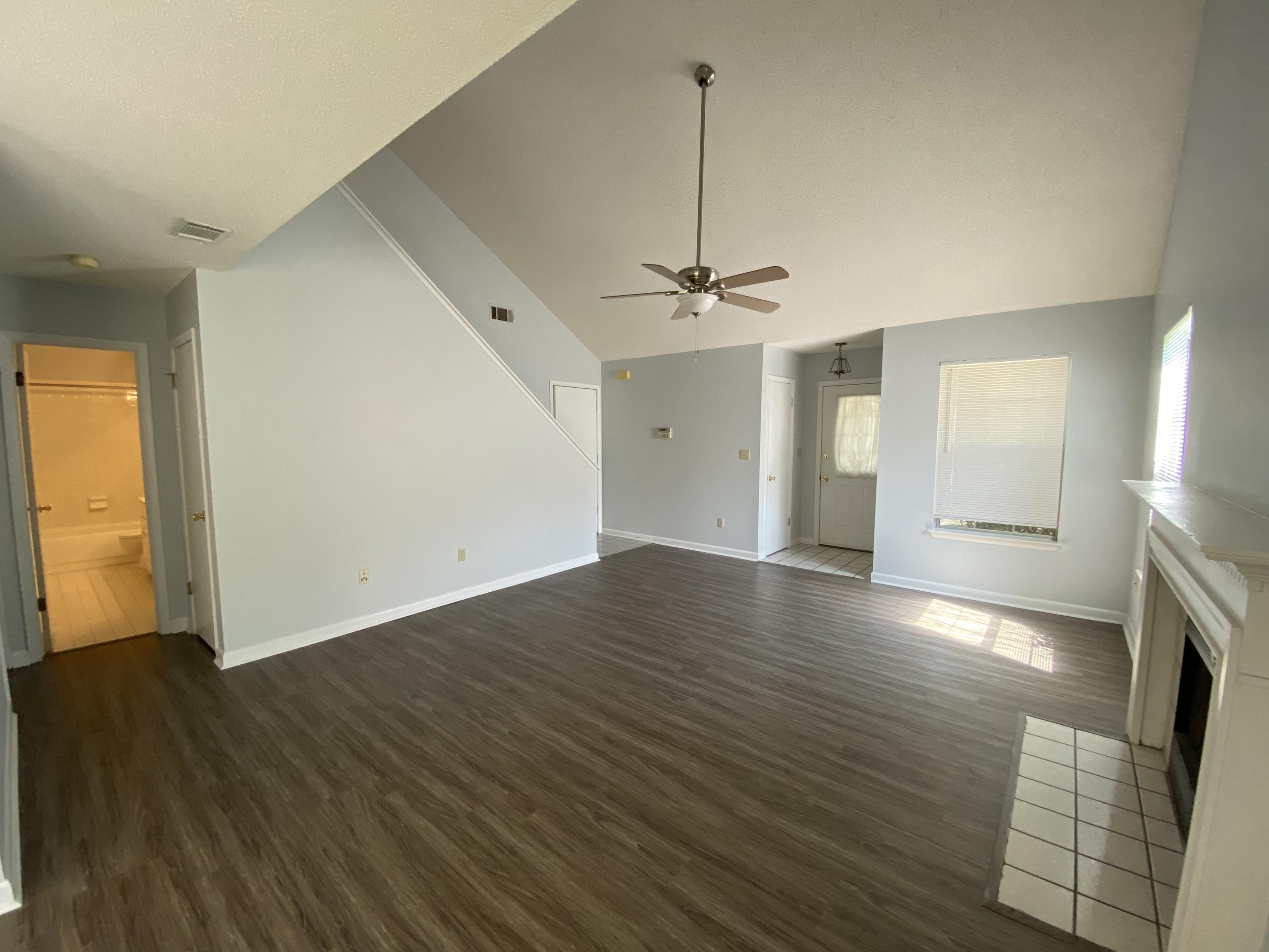 169 Wright Circle Niceville, FL 32578 - Photo 3 of 27 a view of empty room with wooden floor and fan