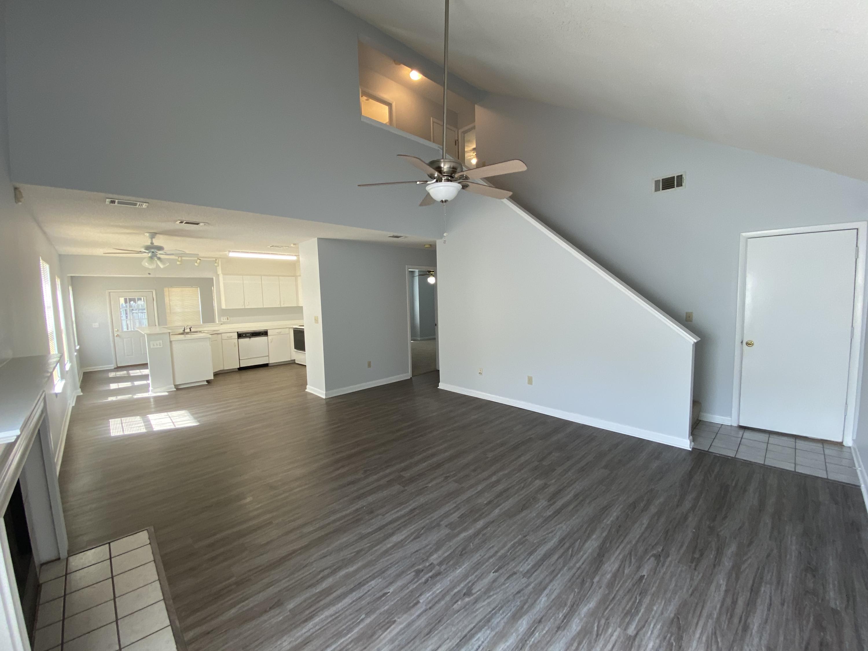 169 Wright Circle Niceville, FL 32578 - Photo 4 of 27 wooden floor in an empty room with a window