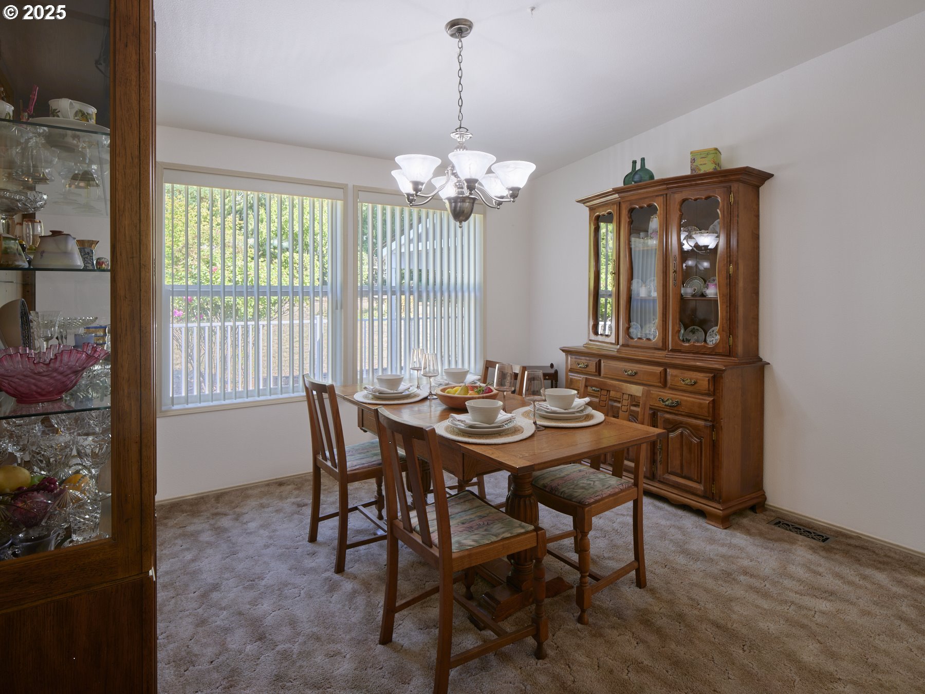 5389 Green Mountain Road Woodland, WA 98674 - Photo 19 of 47 a view of a dining room with furniture and chandelier