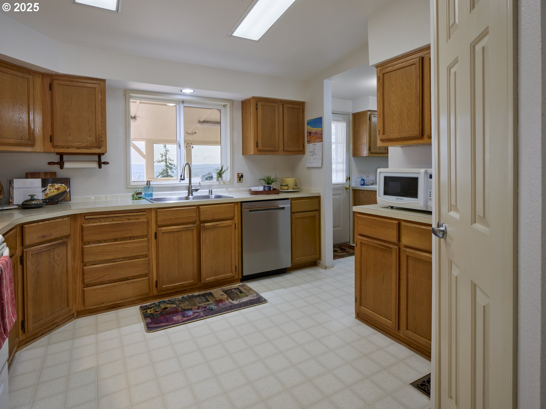 5389 Green Mountain Road Woodland, WA 98674 - Photo 21 of 47 a kitchen with stainless steel appliances granite countertop a stove sink and cabinets