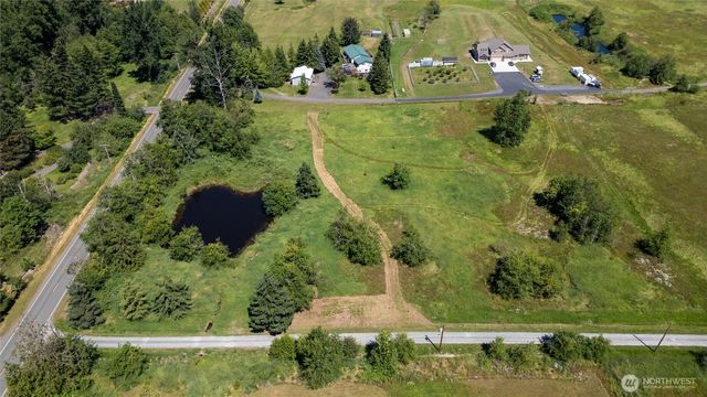an aerial view of residential house with outdoor space
