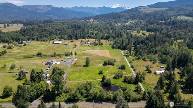 an aerial view of residential houses and outdoor space
