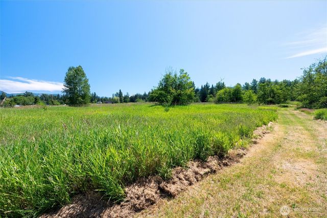 a view of a garden with a lake