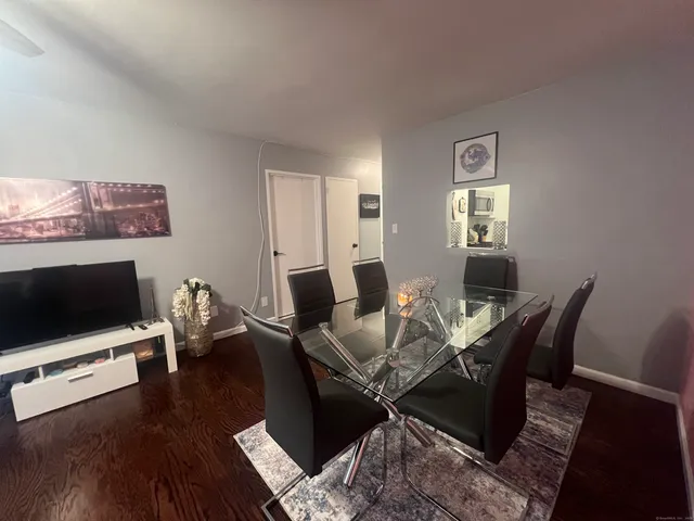 a living room with a bed furniture and a lamp