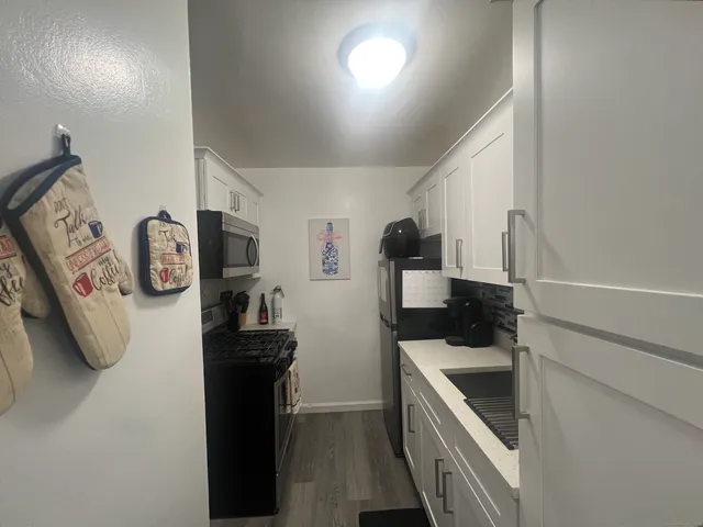 a close view of a sink and a stove in a room