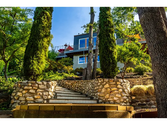 a view of a chairs and table in a yard
