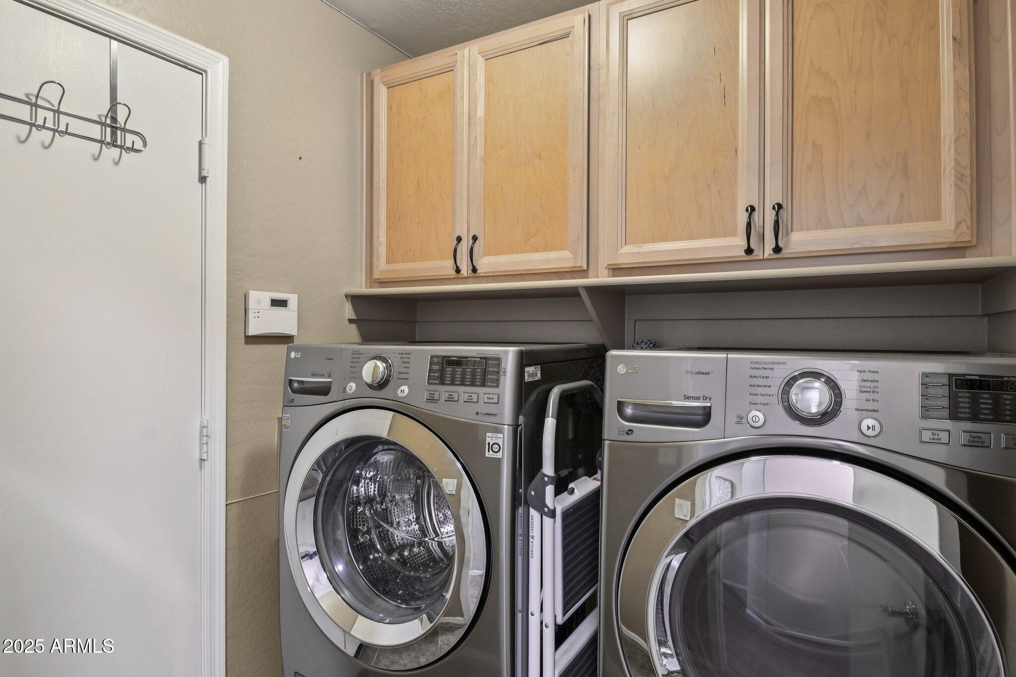 2250 East Deer Valley Drive, Unit 109 Phoenix, AZ 85024 - Photo 10 of 20 a utility room with dryer and washer