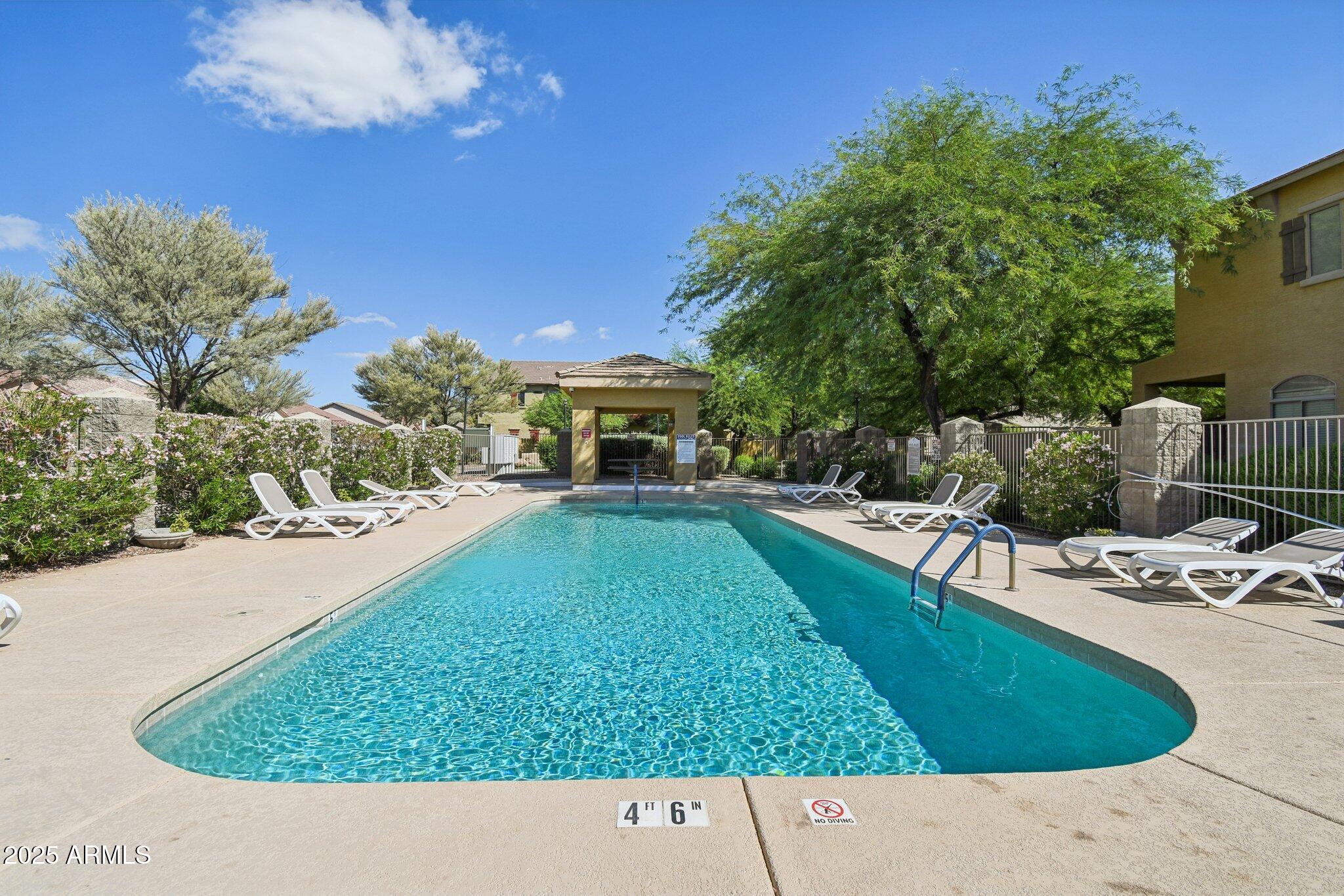 2250 East Deer Valley Drive, Unit 109 Phoenix, AZ 85024 - Photo 11 of 20 a view of swimming pool with a yard