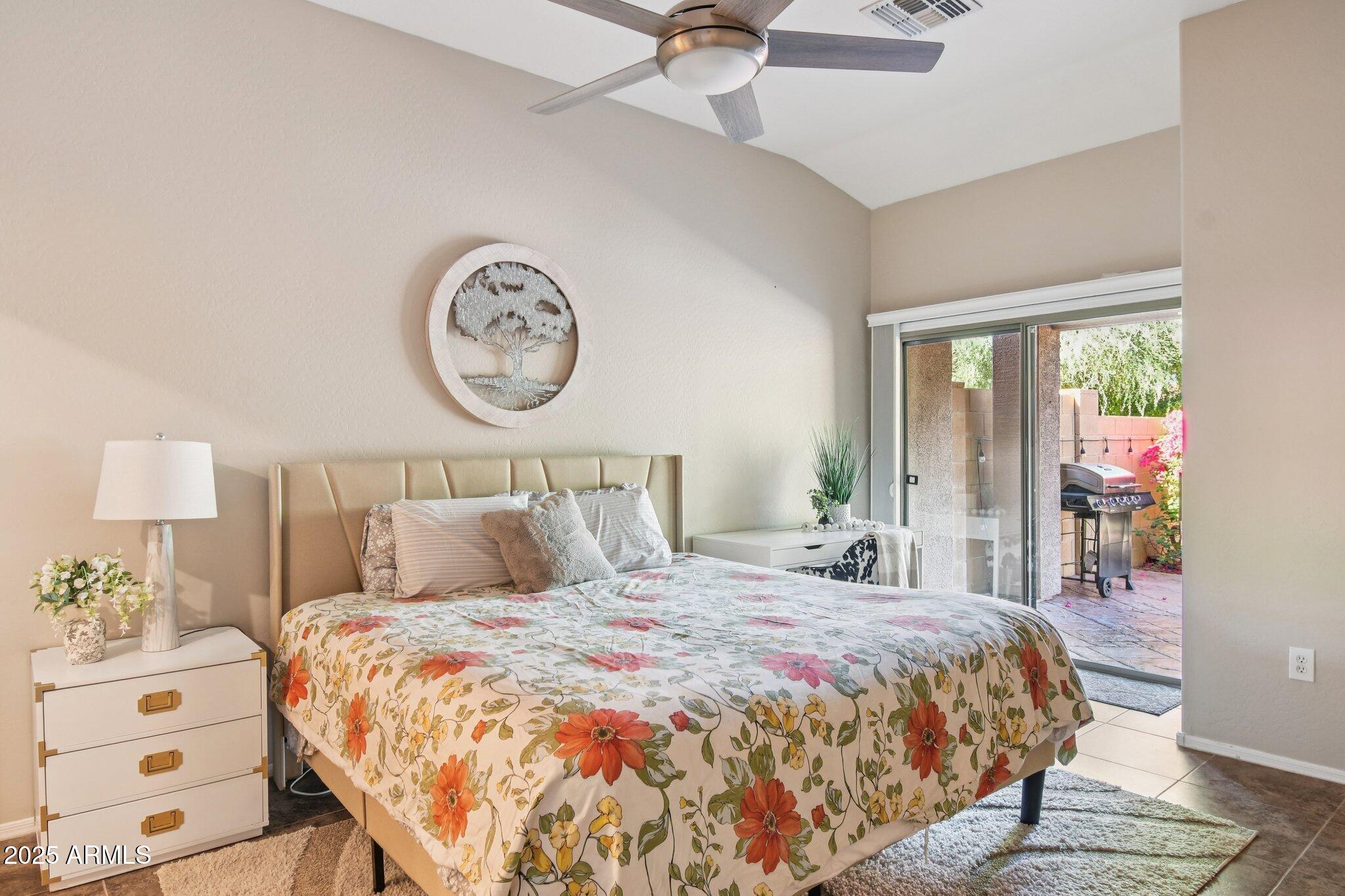 2250 East Deer Valley Drive, Unit 109 Phoenix, AZ 85024 - Photo 6 of 20 a bedroom with a bed and a large window