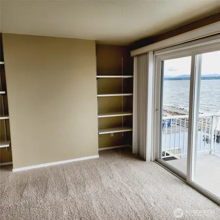 a view of an empty room with a balcony