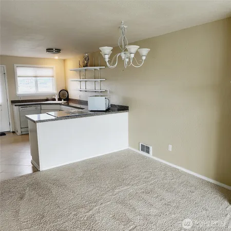 a kitchen with a sink and a stove