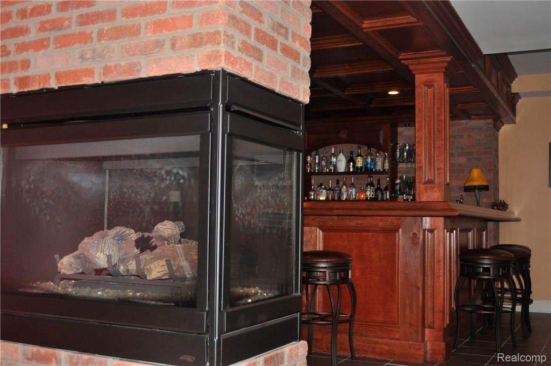 60530 Balmoral Way Rochester, MI 48306 - Photo 56 of 80 fireplace and bar.JPG