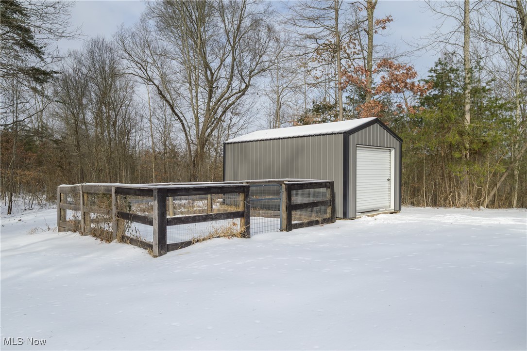 399 Wilder Road Vinton, OH 45686 - Photo 28 of 36 Snow covered structure with a storage unit