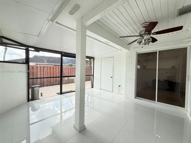 a view of a hallway with a large window