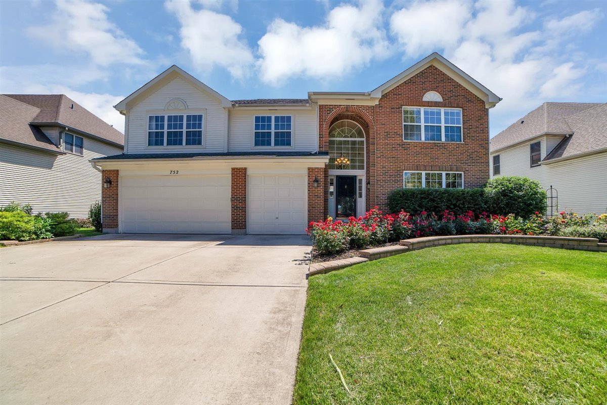 752 Sigmund Road Naperville, IL 60563 - Photo 1 of 55 front view of house with a yard