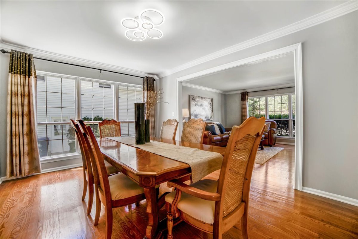 752 Sigmund Road Naperville, IL 60563 - Photo 11 of 55 a view of a dining room with furniture and wooden floor