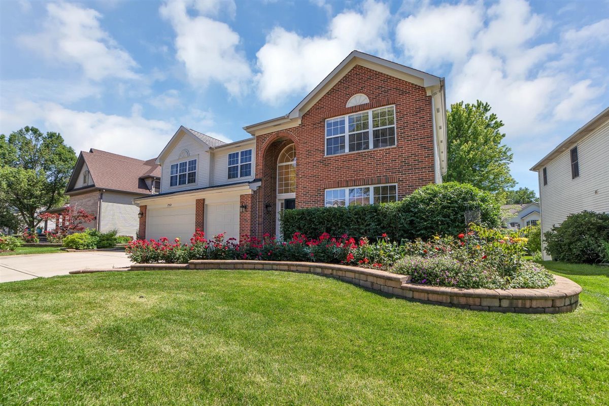 752 Sigmund Road Naperville, IL 60563 - Photo 2 of 55 a front view of a house with a yard