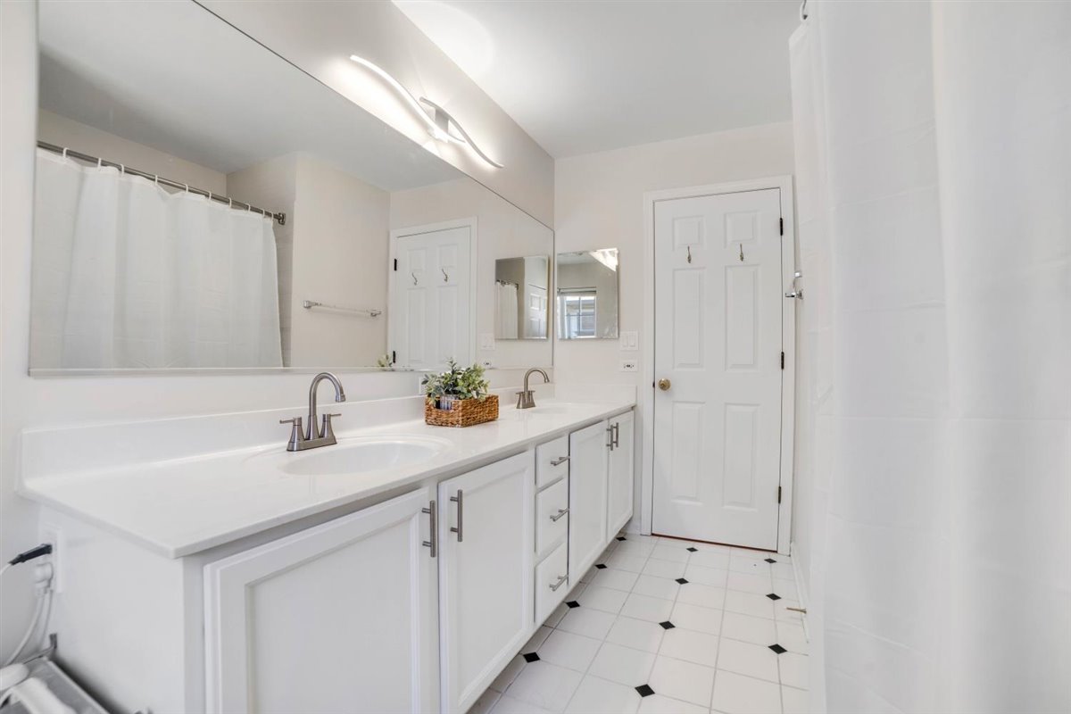752 Sigmund Road Naperville, IL 60563 - Photo 24 of 55 a kitchen with white cabinets