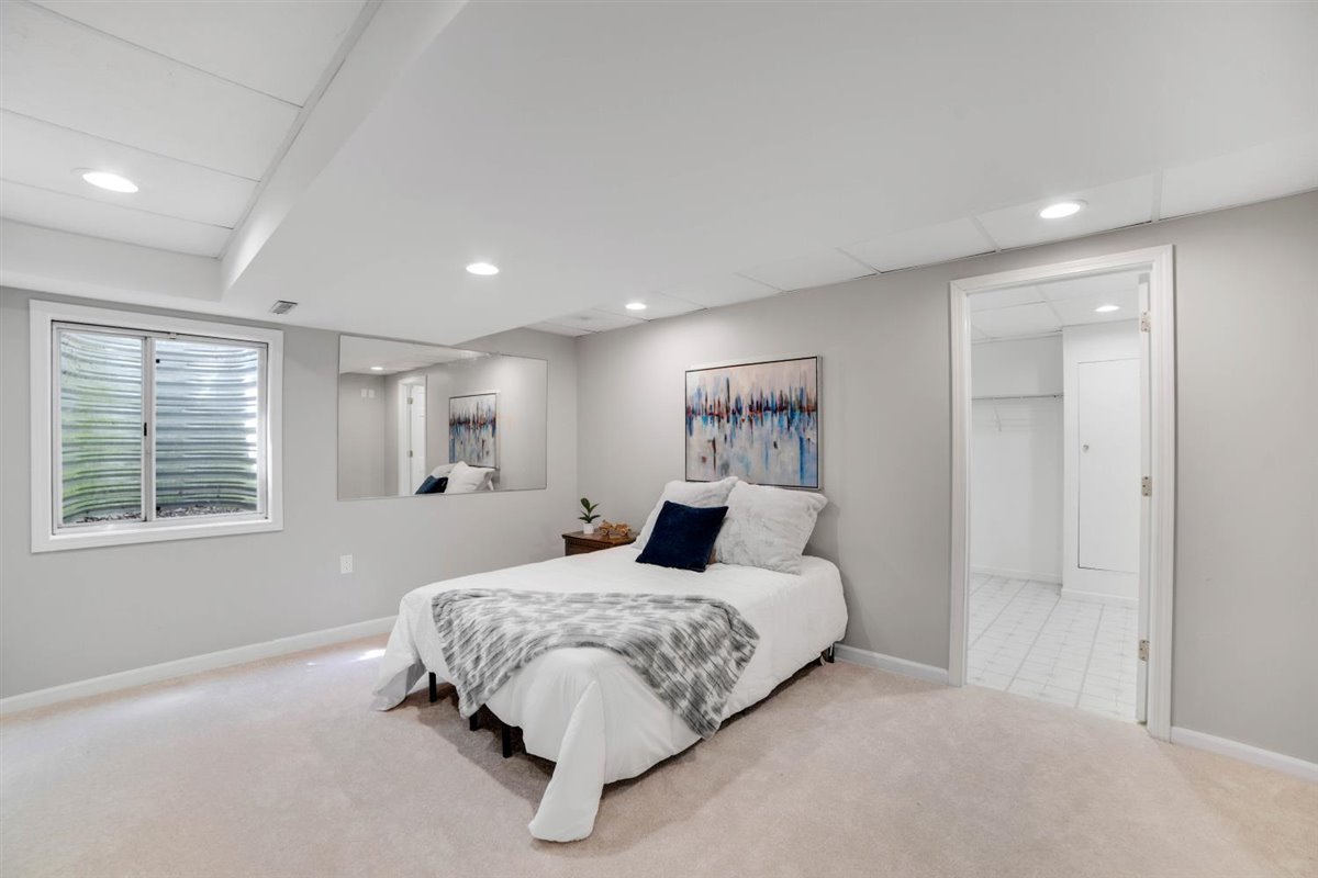 752 Sigmund Road Naperville, IL 60563 - Photo 34 of 55 a bedroom with a large bed and a window