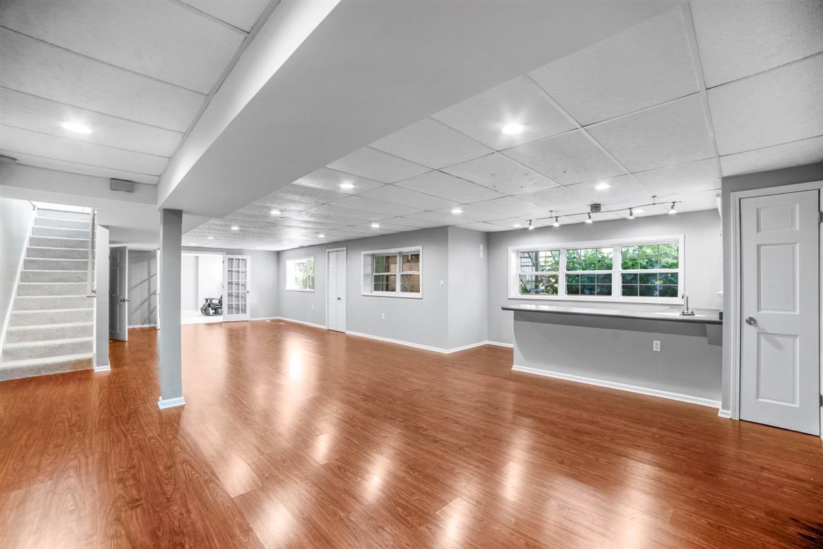 752 Sigmund Road Naperville, IL 60563 - Photo 38 of 55 an empty room with wooden floor and windows