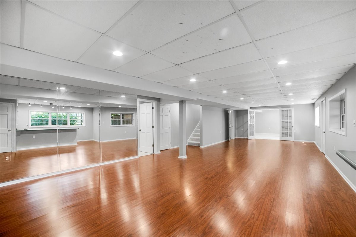 752 Sigmund Road Naperville, IL 60563 - Photo 39 of 55 a view of an empty room with wooden floor and a window