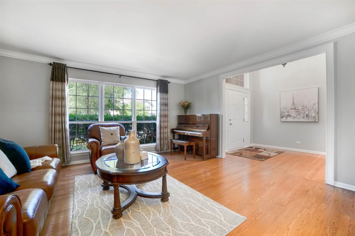 752 Sigmund Road Naperville, IL 60563 - Photo 7 of 55 a living room with furniture a window and a table