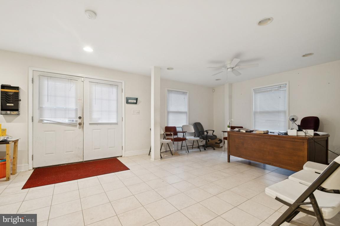 2025 Fairland Road Silver Spring, MD 20904 - Photo 13 of 23 a living room with furniture and a flat screen tv
