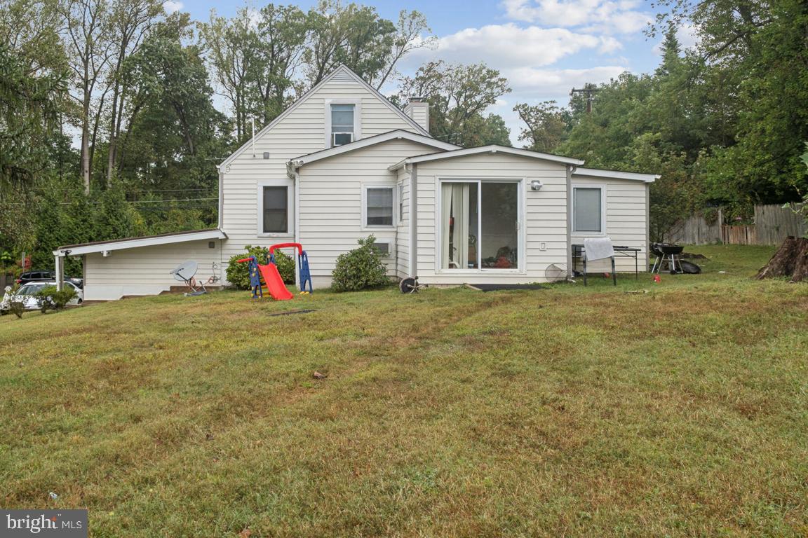 2025 Fairland Road Silver Spring, MD 20904 - Photo 17 of 23 a front view of house with yard and trees in the background