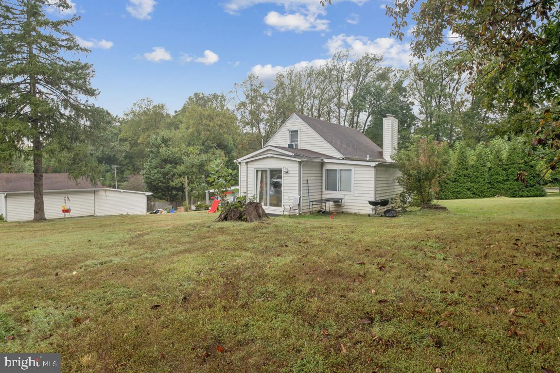 2025 Fairland Road Silver Spring, MD 20904 - Photo 18 of 23 a house with green field in front of it