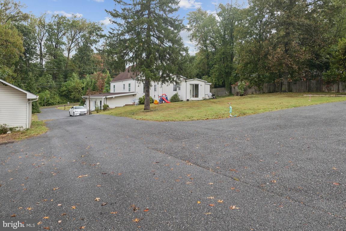 2025 Fairland Road Silver Spring, MD 20904 - Photo 22 of 23 a view of a house with a yard and sitting area