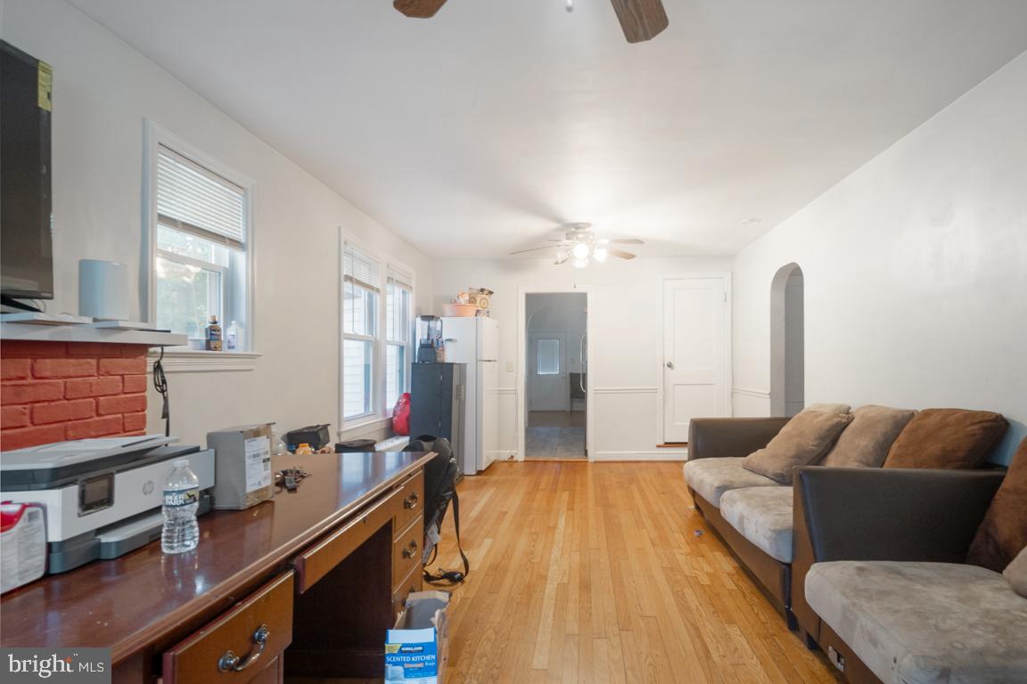 2025 Fairland Road Silver Spring, MD 20904 - Photo 4 of 23 a living room with furniture and a flat screen tv