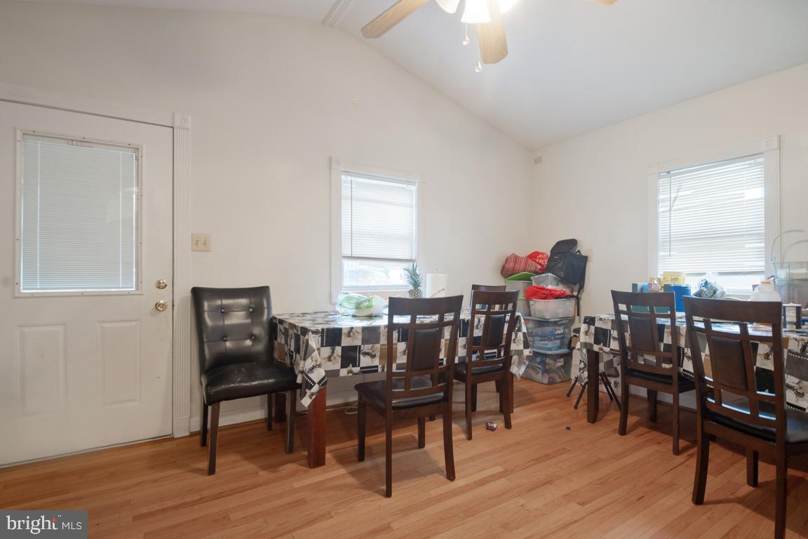 2025 Fairland Road Silver Spring, MD 20904 - Photo 5 of 23 a view of a dining room with furniture and wooden floor