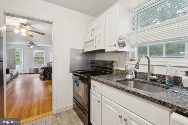 a bedroom with a bed and a view of bathroom