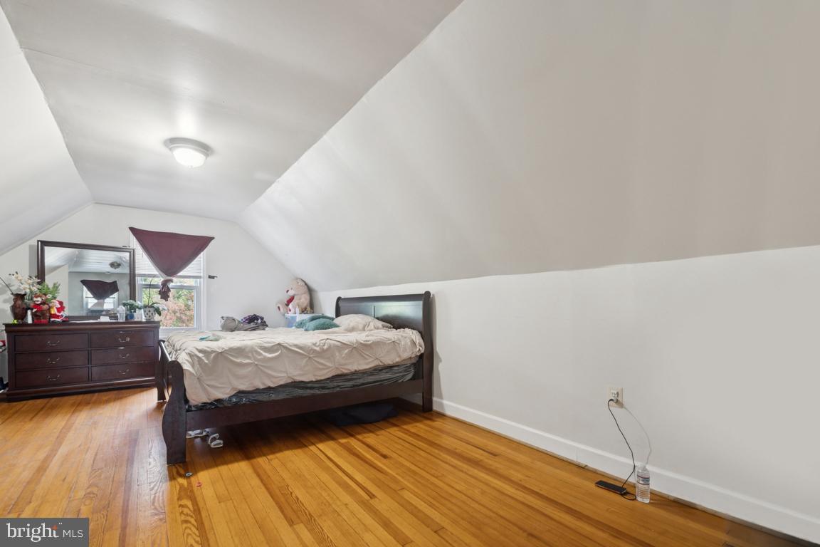 2025 Fairland Road Silver Spring, MD 20904 - Photo 9 of 23 a bedroom with a bed and wooden floor