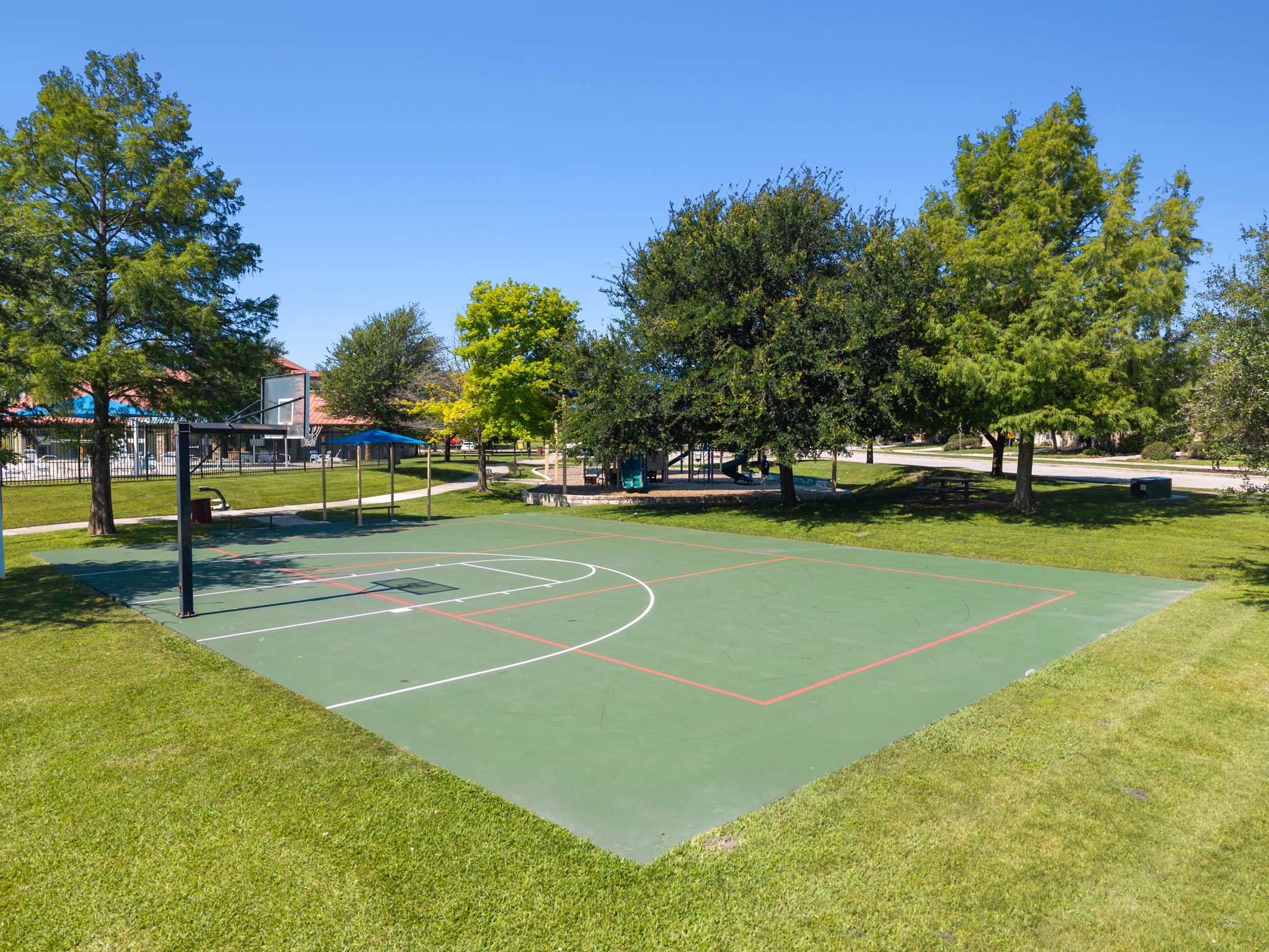 3101 Fresh Spring Road Pflugerville, TX 78660 - Photo 33 of 39 Outdoor basketball court perfect for a neighborhood pick up game.