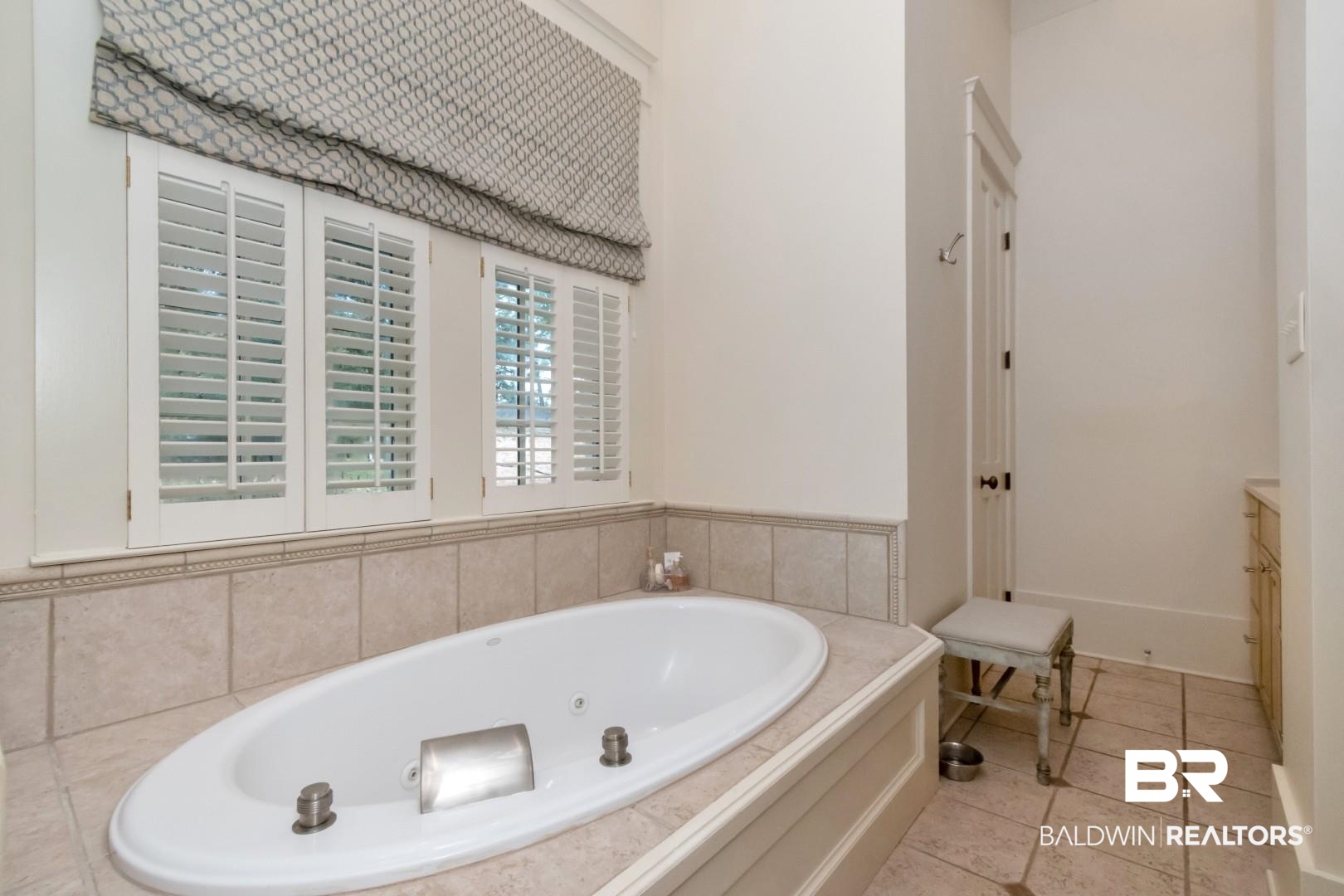 4810 Mums Court Mobile, AL 36608 - Photo 27 of 50 Full bath with a tub with jets, light tile patterned floors, and vanity