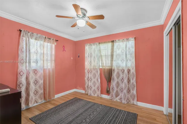 a view of livingroom with furniture and a chandelier fan