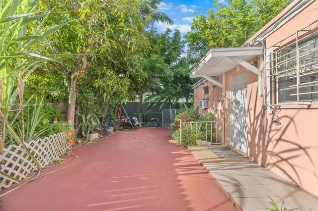 an aerial view of a house with yard