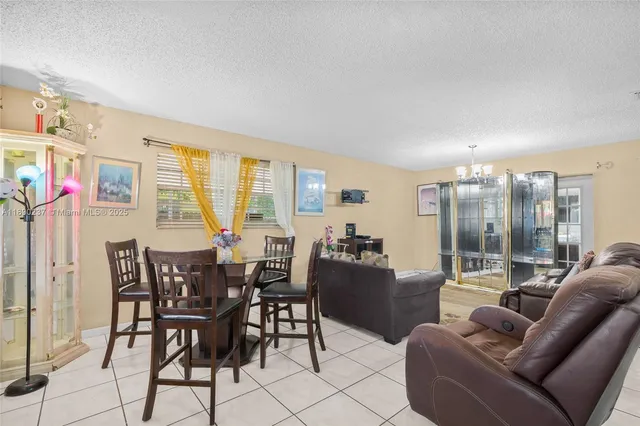a view of a livingroom with furniture and window