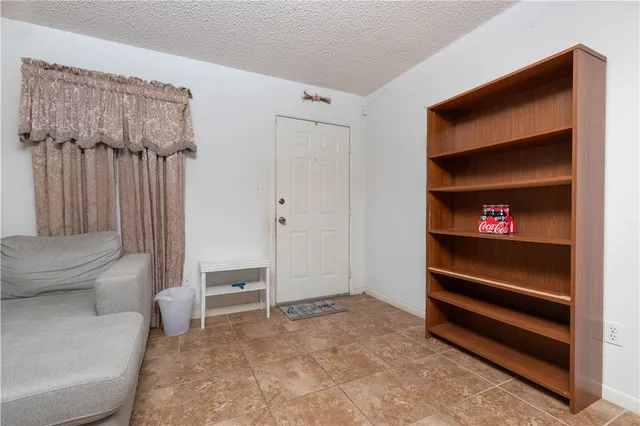 a living room with furniture and a closet