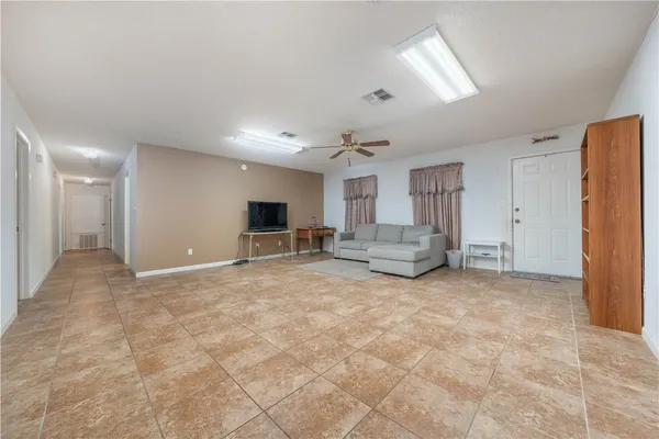 a view of livingroom with furniture and windows