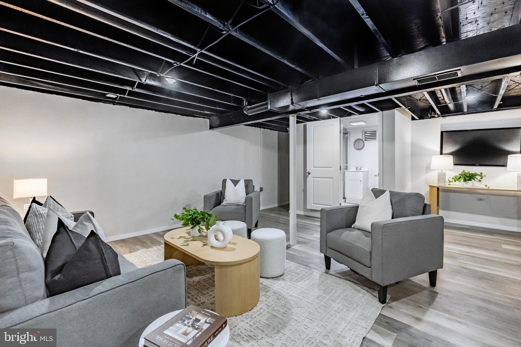 241 South Cedar Lane Upper Darby, PA 19082 - Photo 25 of 29 Modern basement retreat with stylish accents.